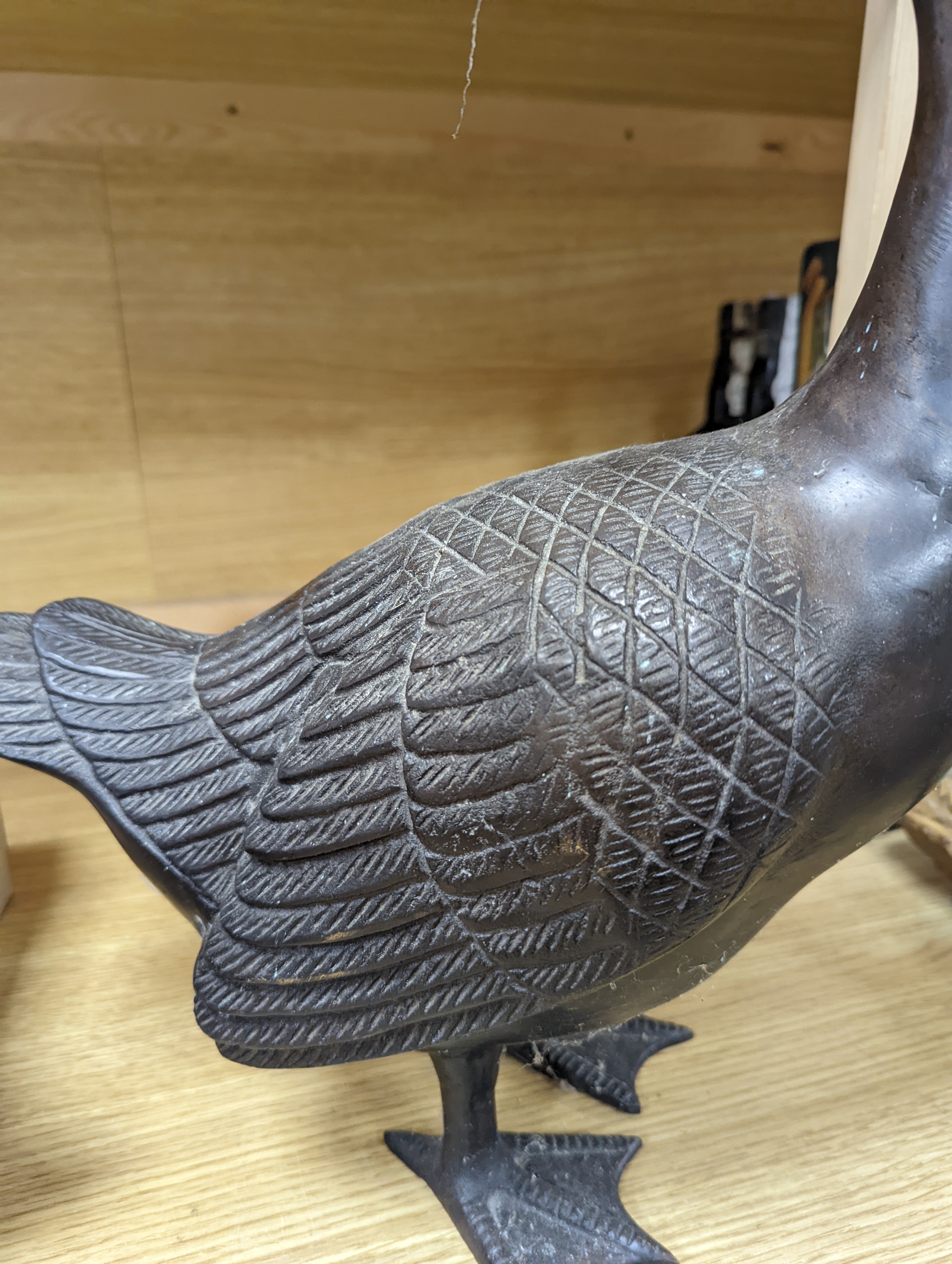 A pair of modern Chinese bronze models of geese, largest 48cm